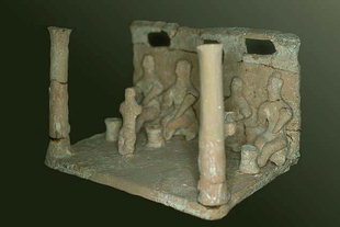 A clay model of worshipers found in the Kamilari tomb