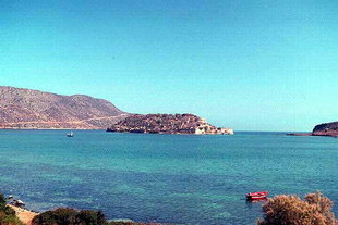 The islet of Spinalonga and the Venetian fort in front of the village of Plaka